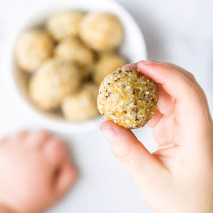 Child Holding an Apricot Ball