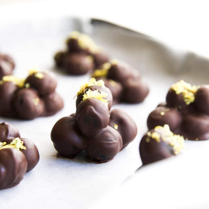 Side on Shot of Chocolate Covered Blueberry Cluster on Baking Tray