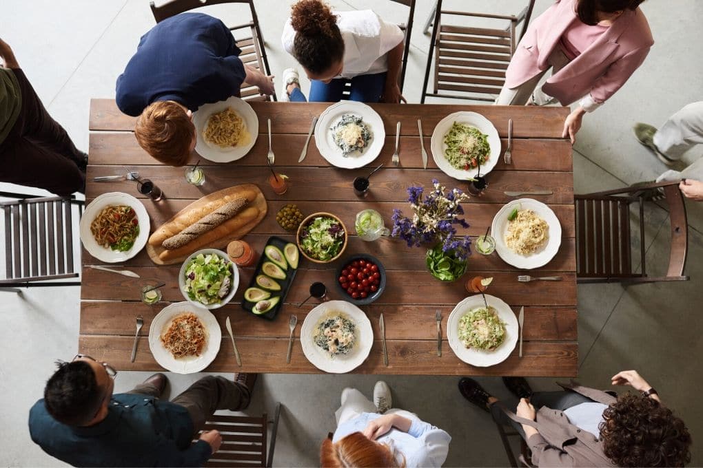 Family About to Sit Down to Family Meal.