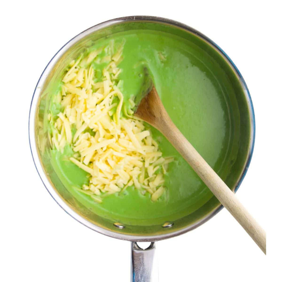 Green Sauce in Pan with Grated Cheese on Top.