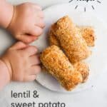 Pinterest Pin with Image of Sweet Potato and Lentil Croquettes on Small Marble Round Board. Baby Hands are Sitting Next to Them. Text Overlay "Lentil and sweet Potato Croquettes" and "Baby and Toddler Recipes".