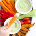 Child Dipping Carrot into Avocado Dip