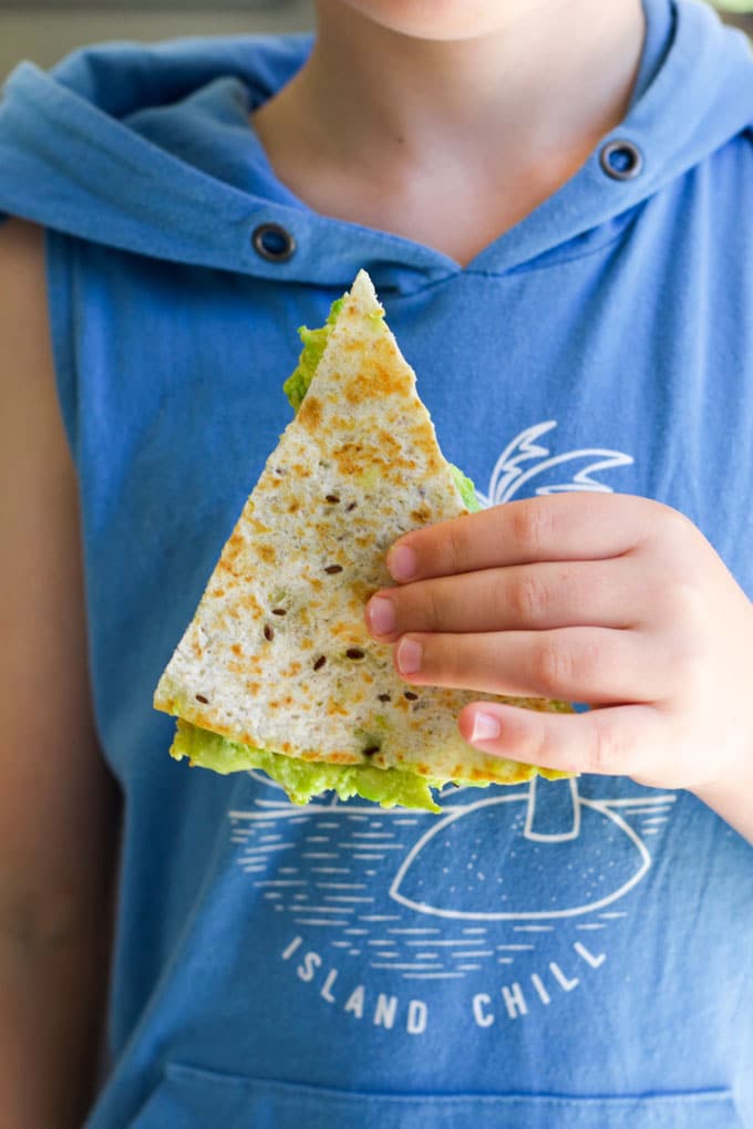 Child Holding Avocado Quesadilla