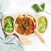 Pasta Topped with Bolognese on Elephant Baby Plate Served With Broccoli and Grapes