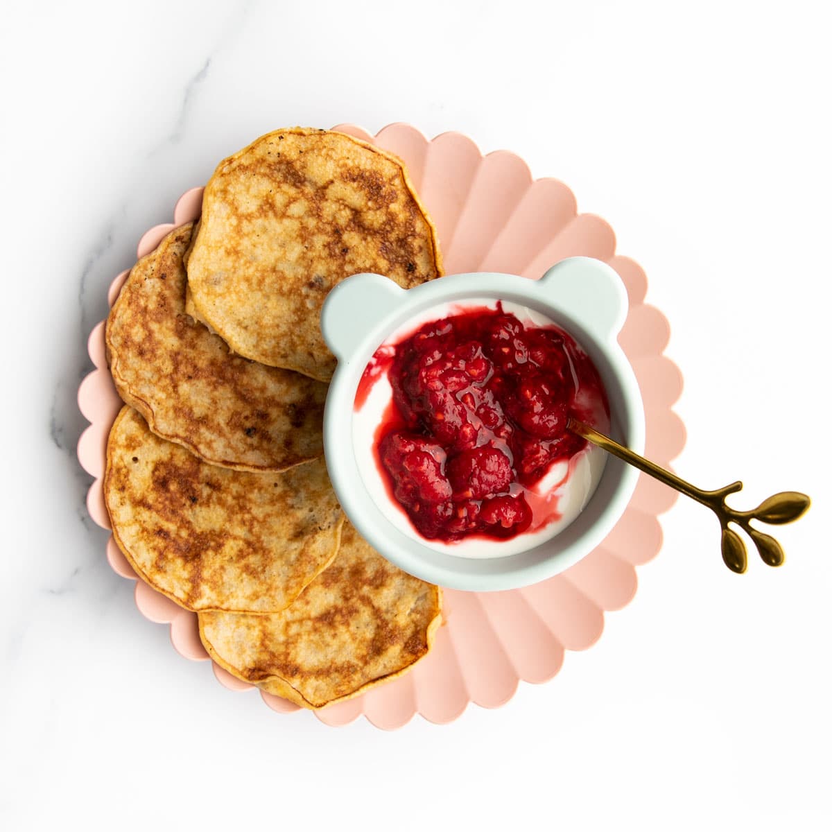 Baby Banana Pancakes on a Plate Served with Yogurt and Berries. 