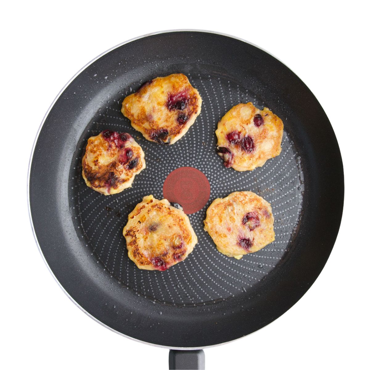 Cooked Banana Blueberry Fritters in Frying Pan.