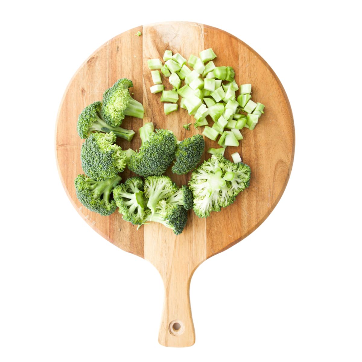 Chopped Broccoli on Wooden Chopping Board.