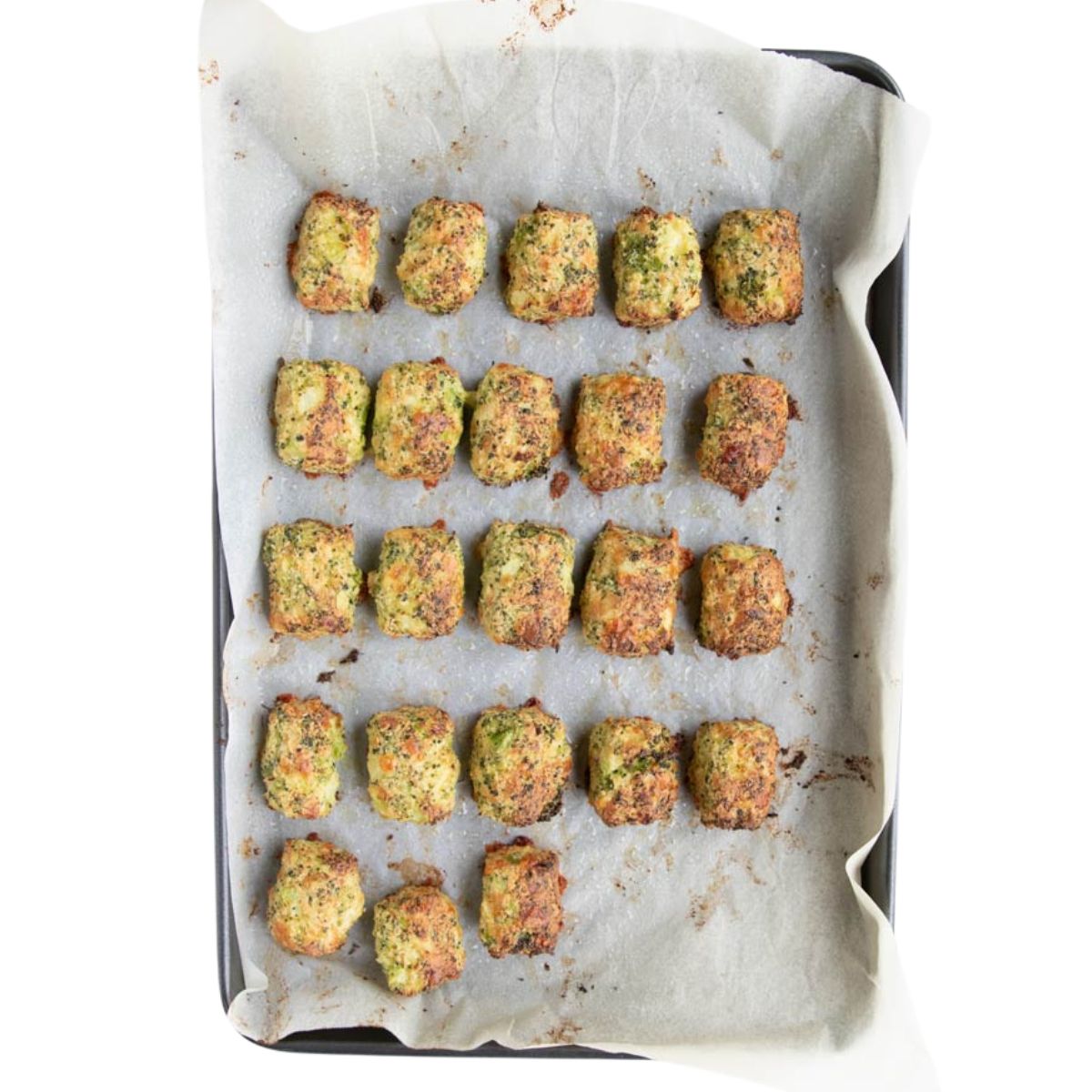 Cooked Broccoli Tots on Baking Sheet. 