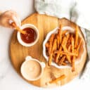 Carrot Fries Served in Bowl with Dips Child Dipping one Fry.