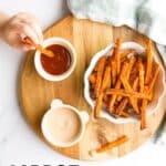 Pinterest Pin Showing Image of Child Dipping Carrot Fry into Ketchup and Text Overlay "Carrot Fries".