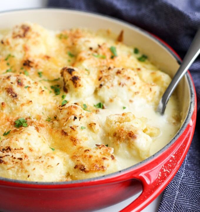 Side View of Cauliflower Cheese In Red Dish