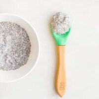 Top Down View of Chia Seed Gel in a Small Bowl With Spoonful Sitting Next to It