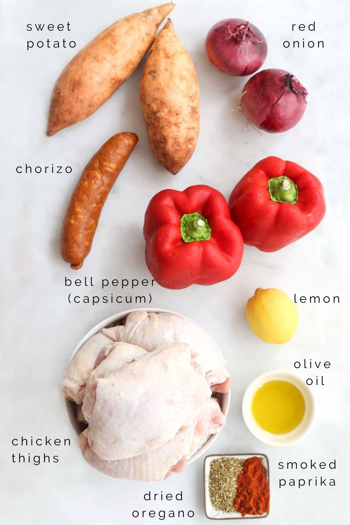 Flat Lay Shot of All the Ingredients Needed to Make Chicken Chorizo Tray Bake.