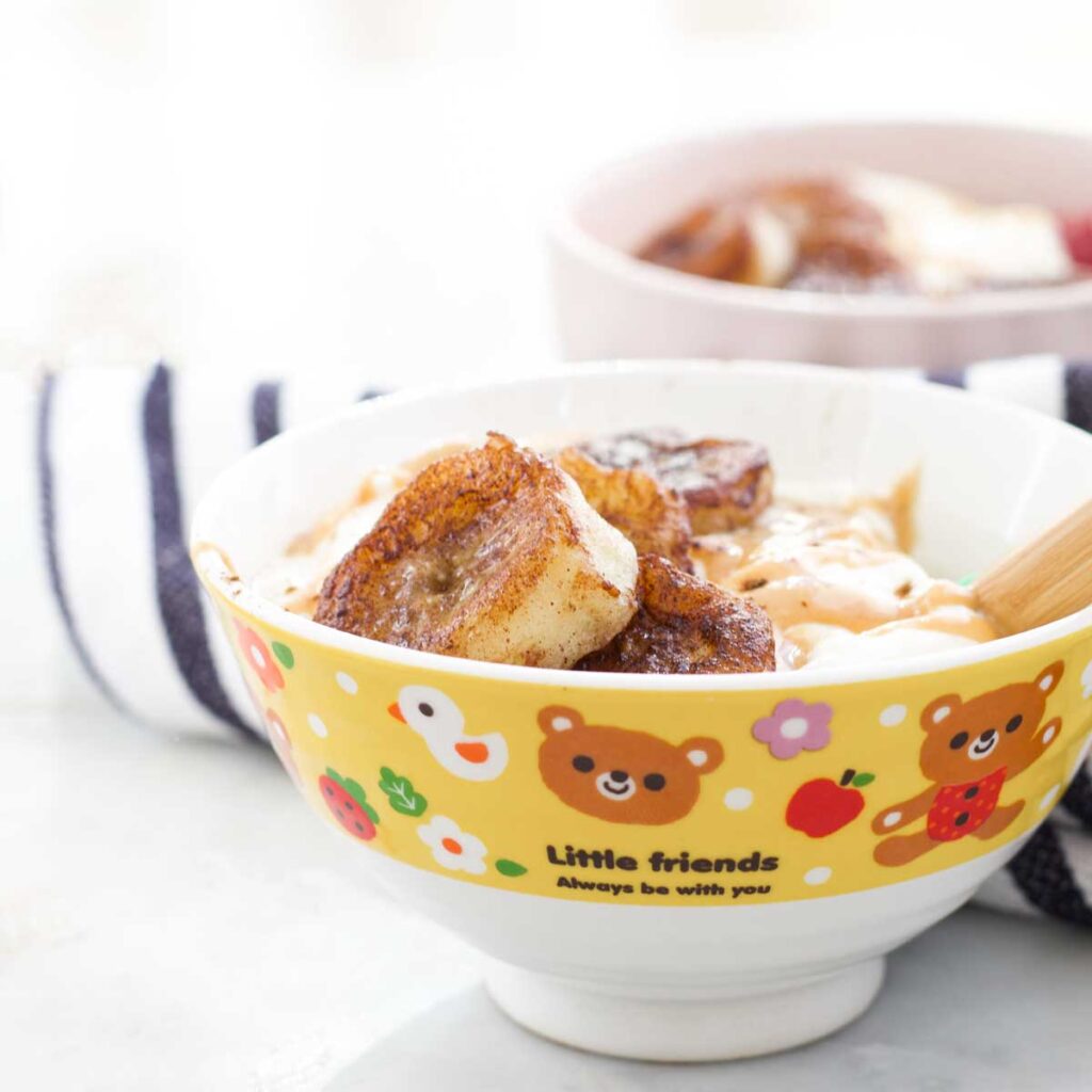 Kids Bowl of Yoghurt Topped with Pan fried Bananas