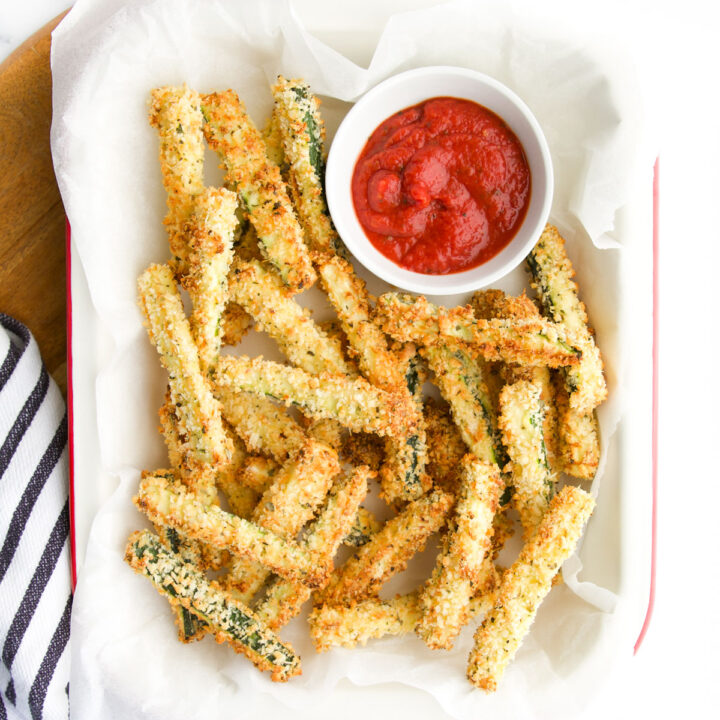 Courgette (Zucchini) Fried in Tray with Small Bowl of Pizza Sauce.