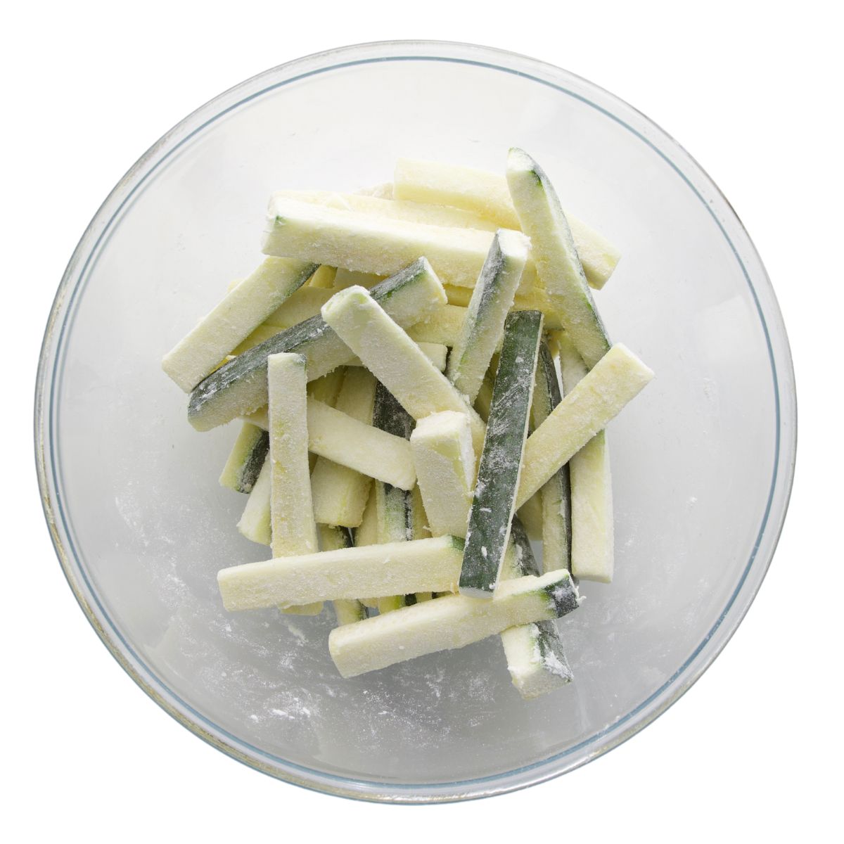 Courgette Battons in Bowl Coated with Flour. 