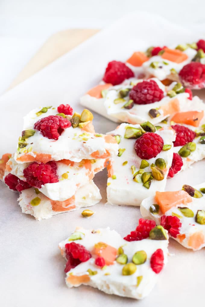 Frozen Yoghurt Bark Broken into Pieces and Served on Wooden Board