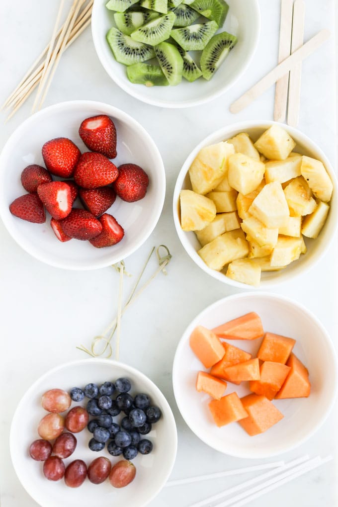 Fruit Cut Up in Bowls with Kebabs Sticks for Skewering