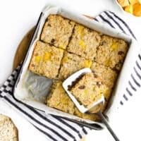 Baked Mango Oatmeal Cut Into Squares in Pan.