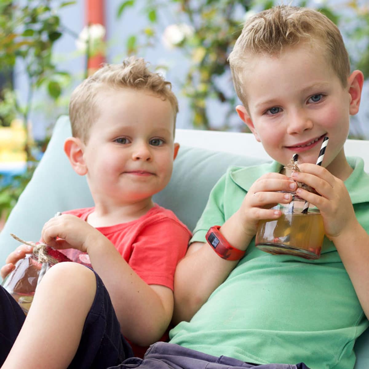 Two Young Boys Drinking Mocktails.