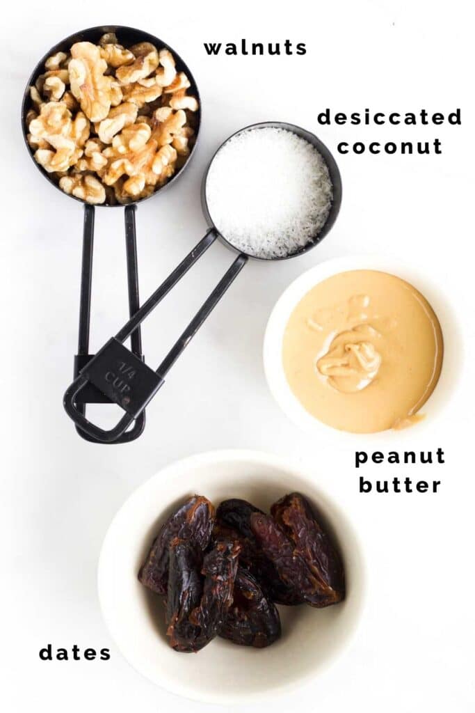 Flat Lay of the Ingredients Needed to Make Nut Balls (Walnuts, Coconut, Peanut Butter and Dates)