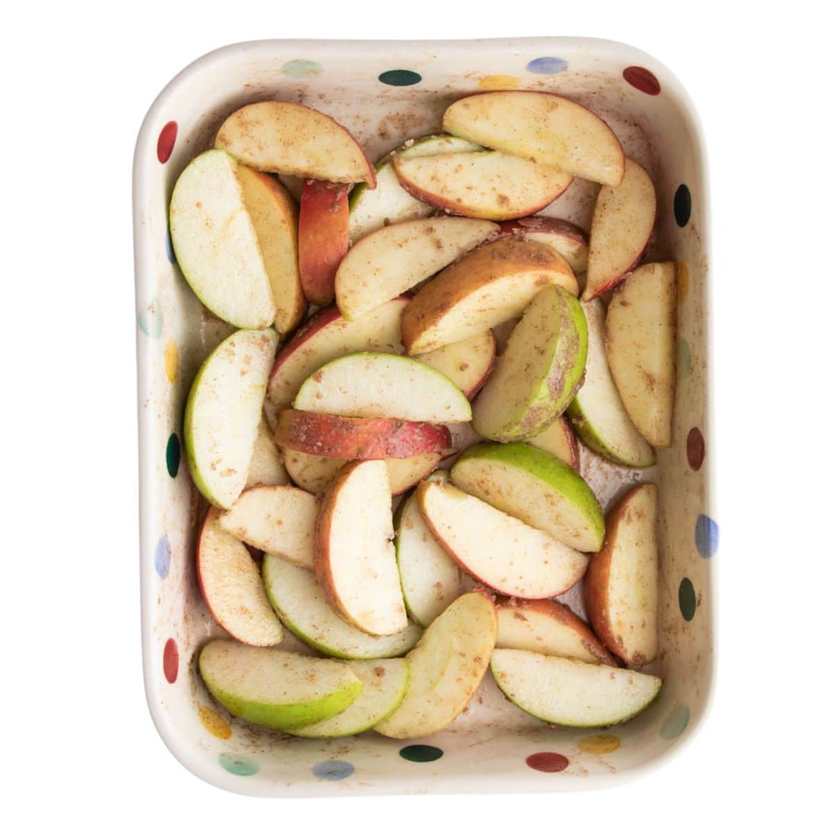 Raw Apple Slices in Baking Dish. 