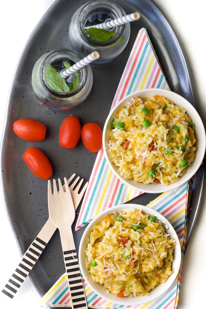 Top Down View of Sundried Tomato and Vegetable Risotto in Kids' Bowls.