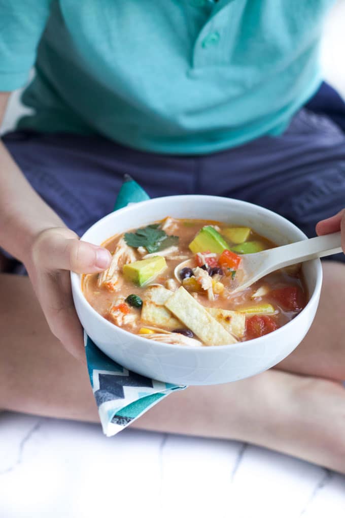 Child Eating a Bowl of Chicken Tortilla Soup