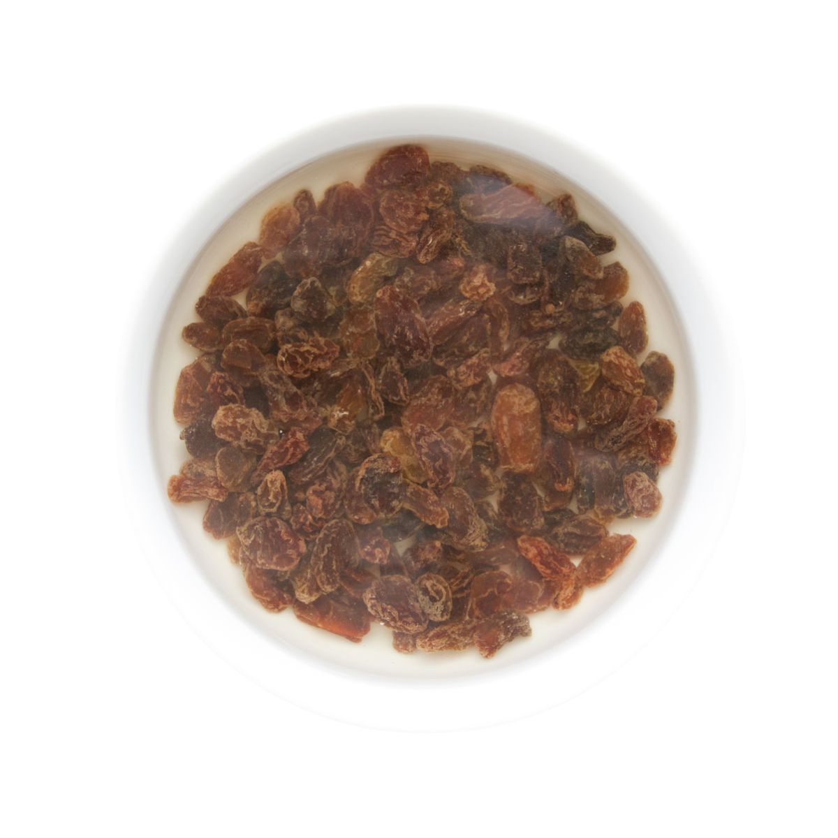 Raisins in Bowl with Hot Water. 