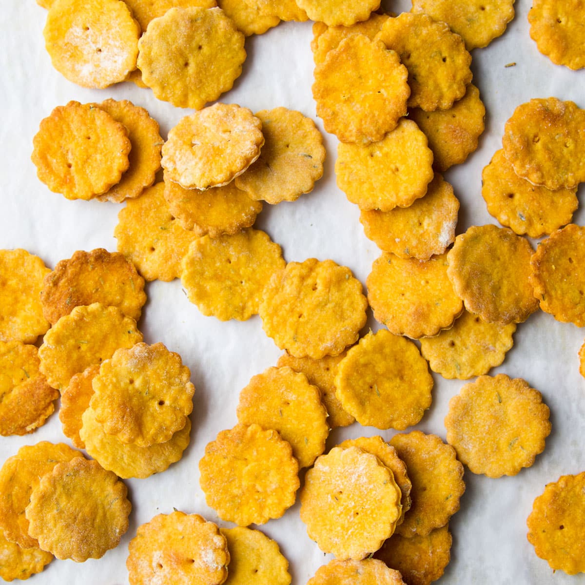 Close Up Shot of Sweet Potato Crackers on Lined Baking Tray.