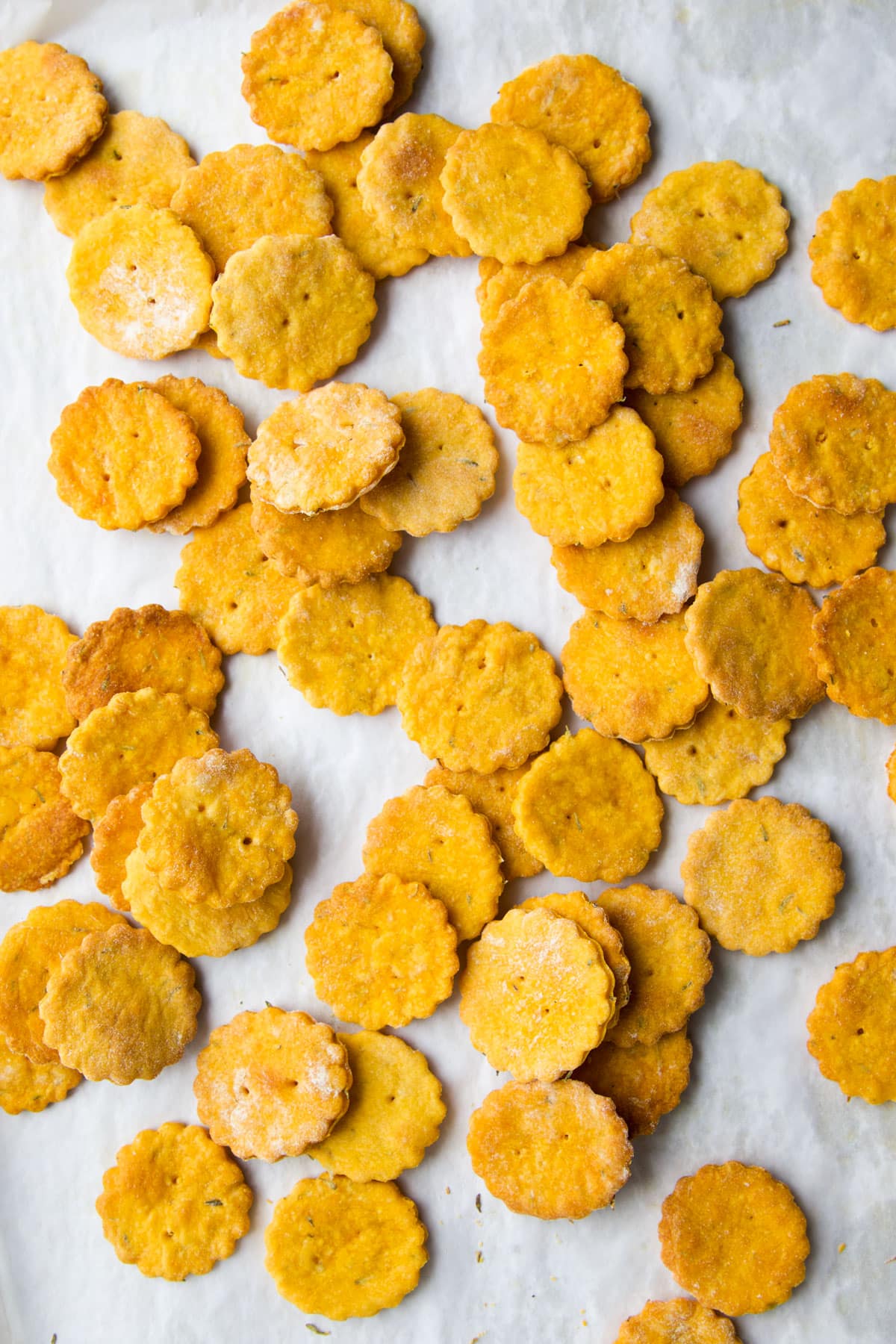 Close Up Shot of Sweet Potato Crackers on Lined Baking Tray.