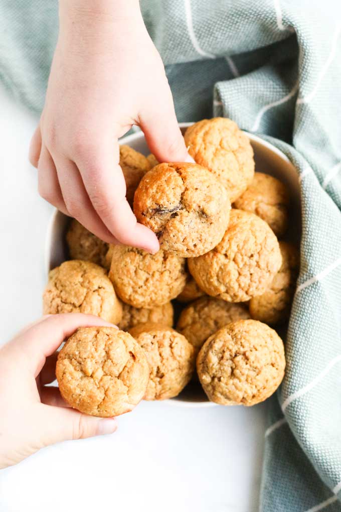 Children Grabbing Sweet Potato Muffins from Bowl