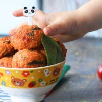 Child Grabbing Quinoa Ball from Bowl