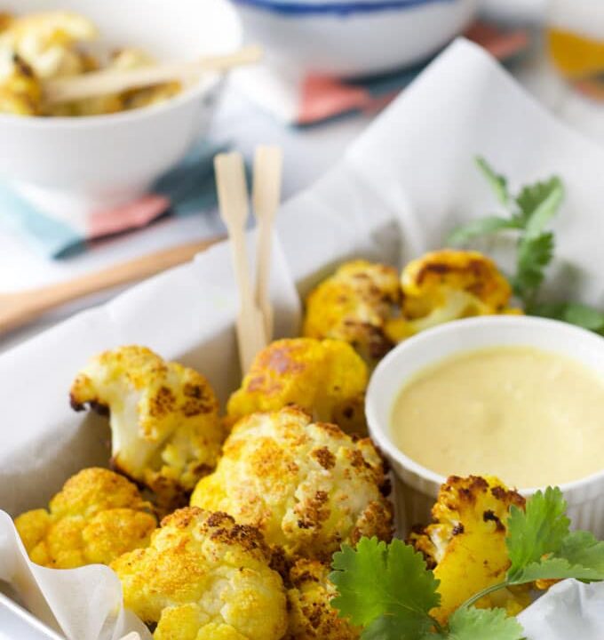 turmeric oven roasted cauliflower bites with a sweet curried mango dip. A kid friendly way to save cauliflower