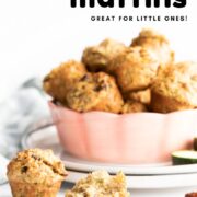 Zucchini Muffin Pinterest Pin with Image of Zucchini Muffins in Bowl with One in Forefront with Bite Removed.